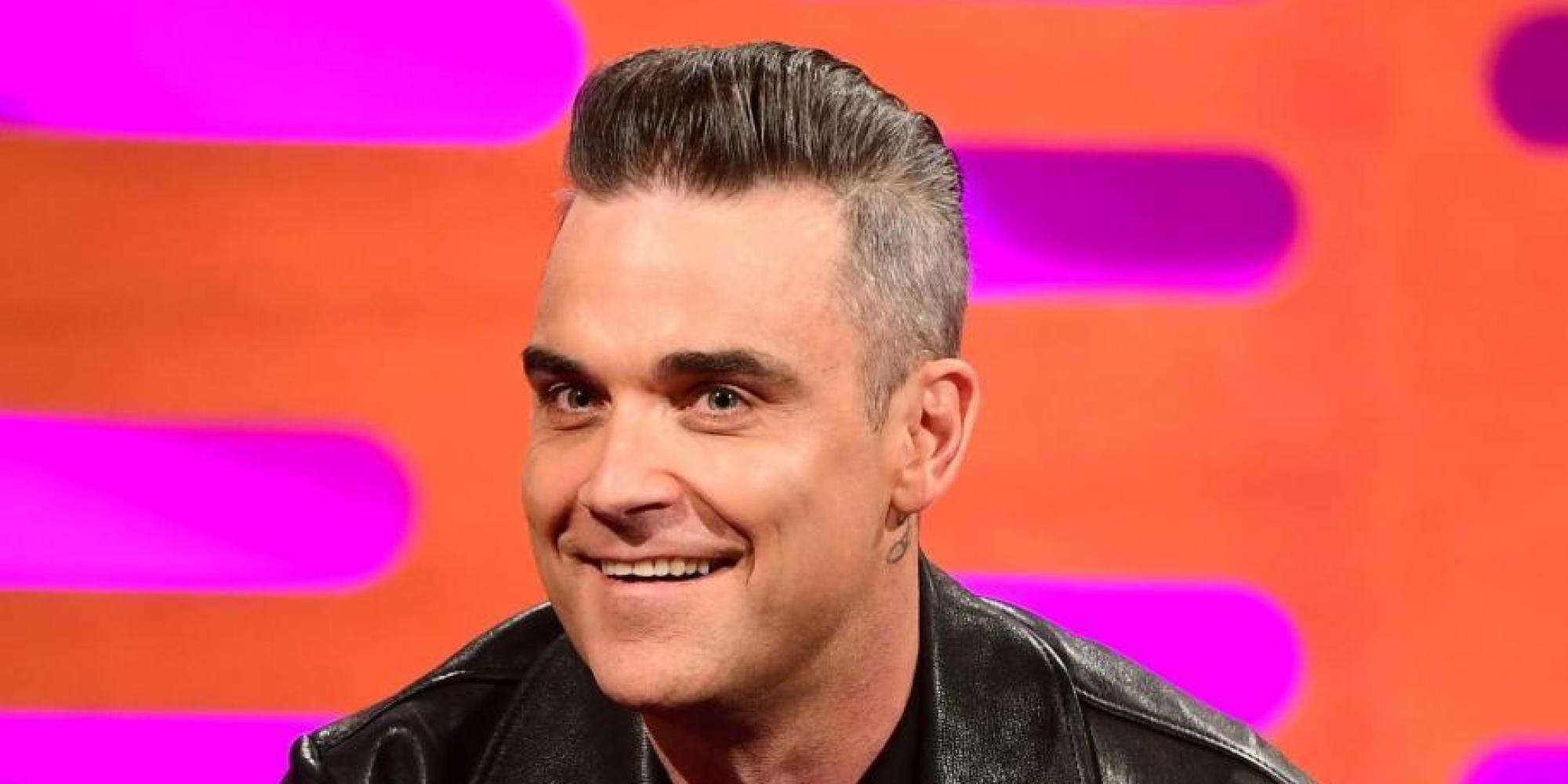 Che cosa ha fatto in faccia Robbie Williams?