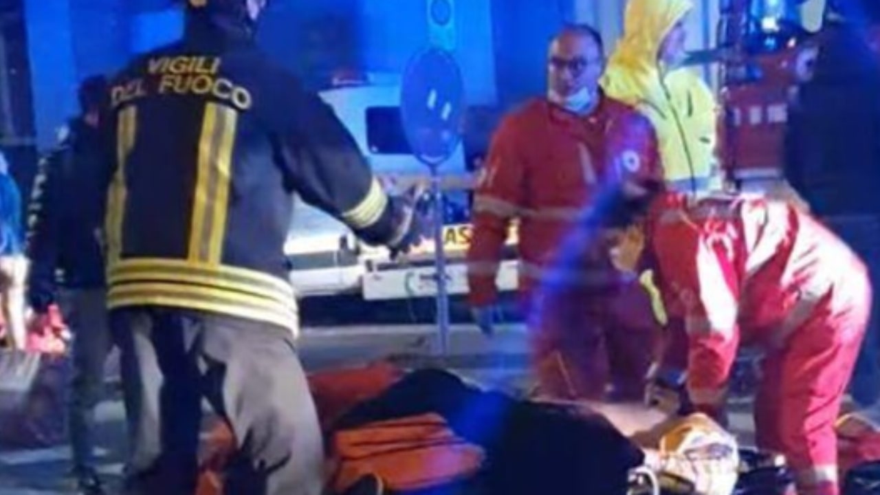 Rescuers arrive to help the injured boys in the car