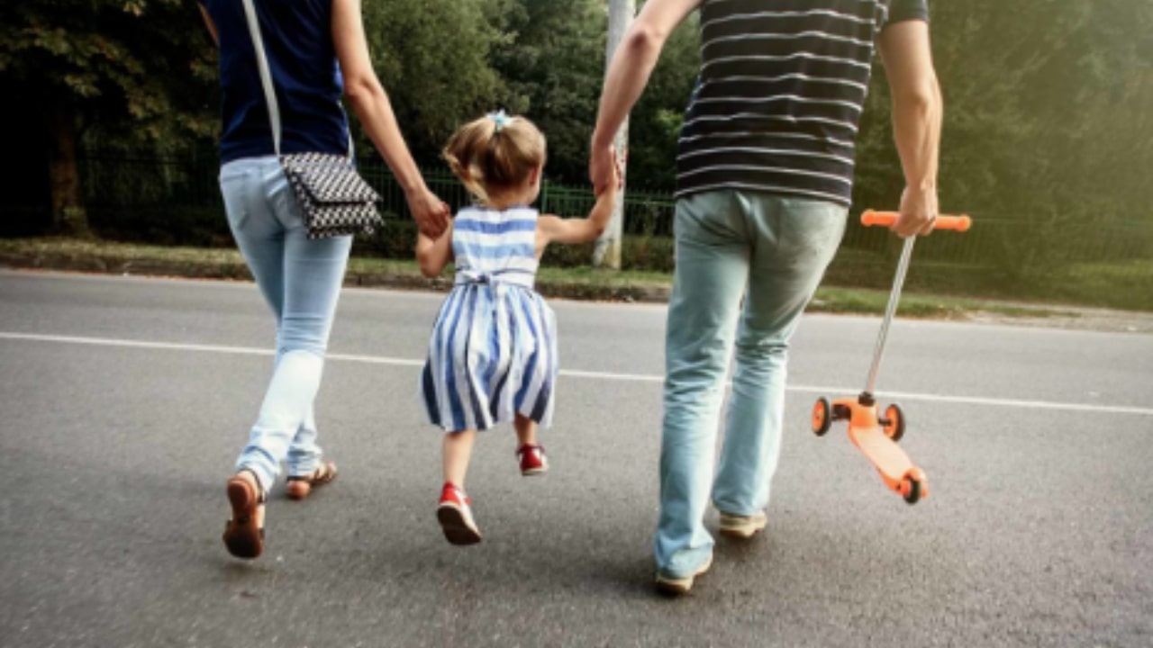 Child gets hit while crossing the street with his father